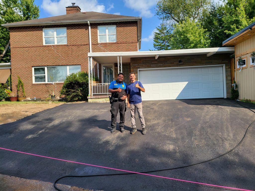 Finished parking lot with team member and customer